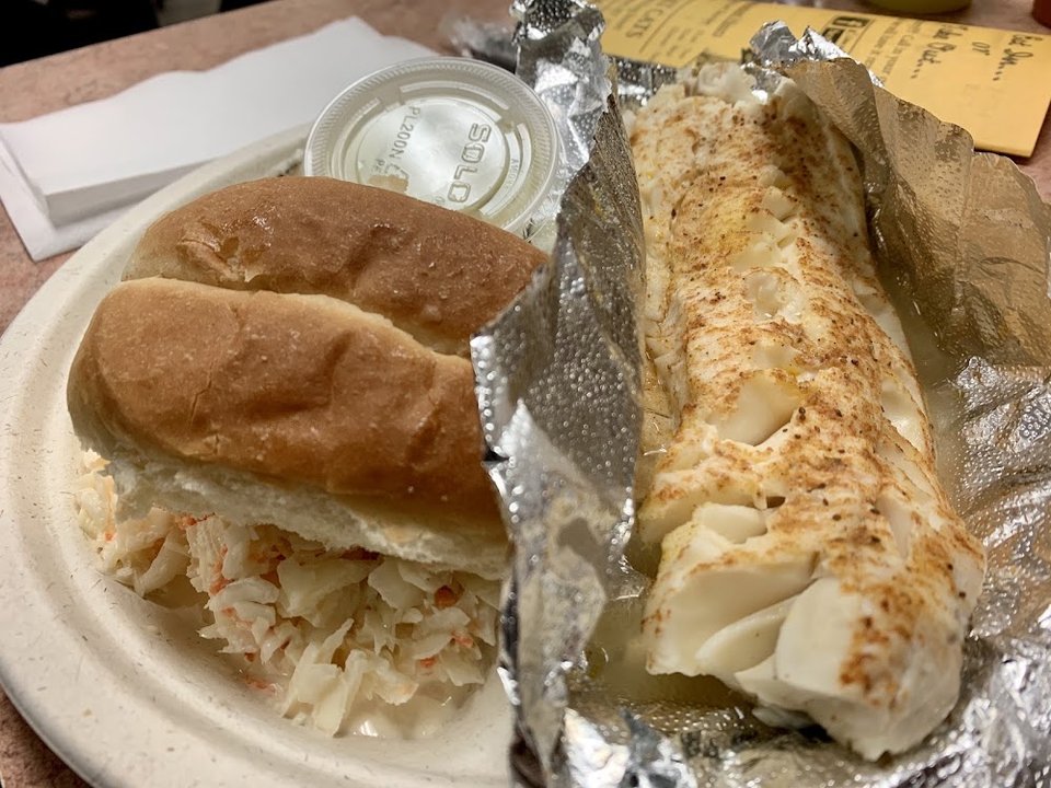 Restaurant menu showing sandwiches, platters, and specials.