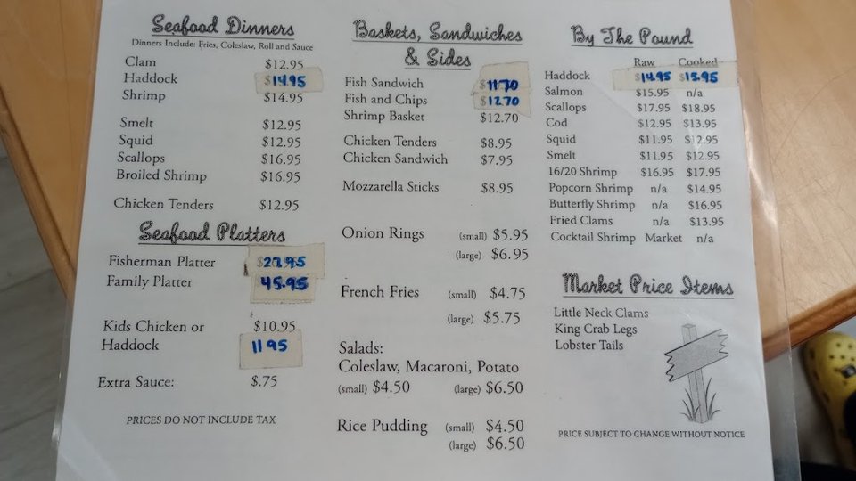 Seafood menu page with platters and sides.