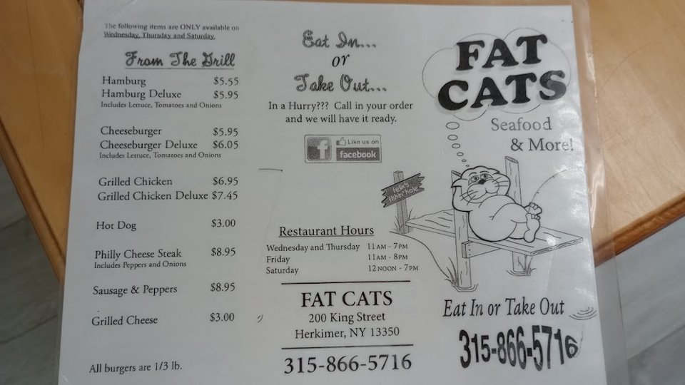 Restaurant menu showing sandwiches, platters, and specials.